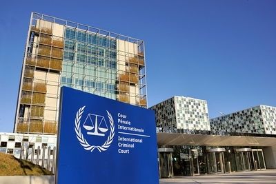 International Criminal Court building and sign beneath a clear blue sky